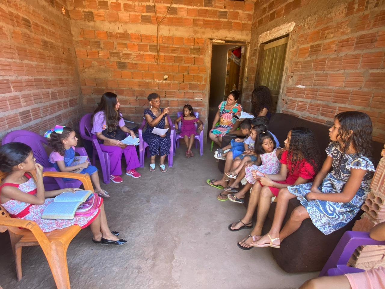 Mission team leading a Bible gathering in a home