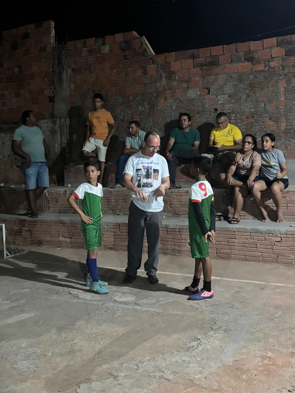 Children gathered for prayer during soccer evangelism